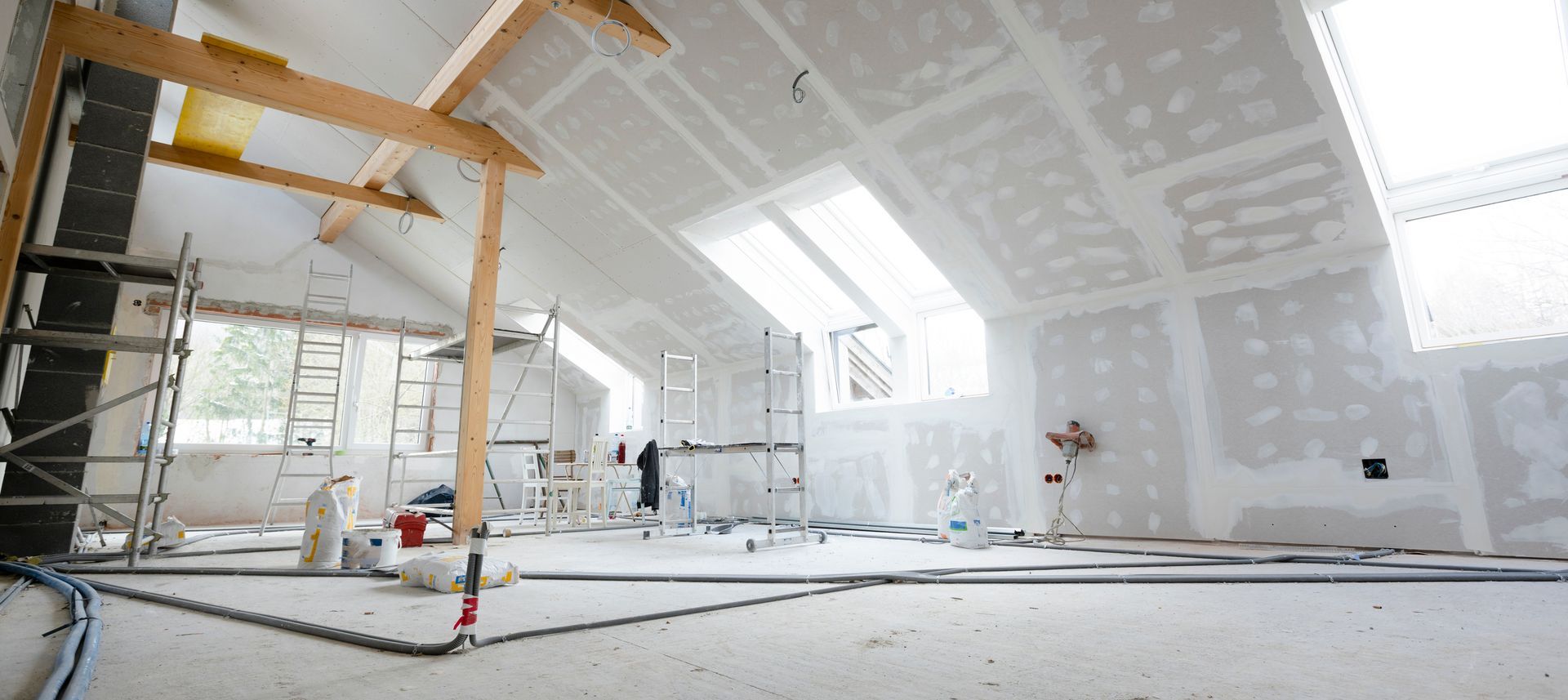 Interior wall being painted during a home renovation
